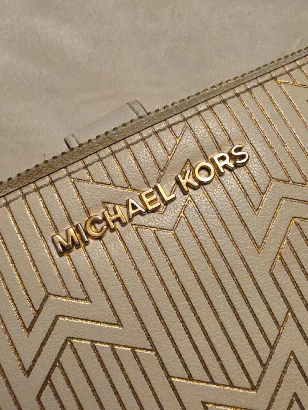 Michael Kors Cream Embossed Wristlet with Gold Accents